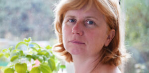 Woman with red hair looking sad