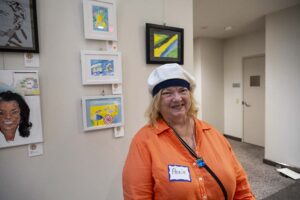 Pathway Homes hosted an Artist Reception as part of its 11th Annual Summer of the Arts Exhibit on July 10, 2024. The reception was held in the same space as the exhibit in the South Atrium of the Fairfax County Government Center. The exhibit is a way for Pathway clients who have mental health challenges to showcase and sell their own art. Pathway Homes, Inc. is hosting an Artist Reception in the South Atrium of the Fairfax County Government Center as part of its 11th Annual Summer of the Arts Exhibit, where Pathway Homes’ residents who have mental health challenges showcase and sell their own art, poetry, and crafts. More than 83 pieces from 18 artists were on display as attendees took the opportunity to meet these talented people and celebrate their artistry. Pathway Homes is a nonprofit providing mental health services—starting with safe, stable housing—to individuals marginalized by poverty and inequity. Art and creativity are an integral part of recovery for Pathway Homes’ residents. Artists receive 100 percent of the proceeds. For more than 44 years, Pathway Homes has enabled tens of thousands of people in Northern Virginia with serious mental illnesses and other co-occurring disabilities to get housing and supportive services to help them recover their lives. The event supports the unique talents of Pathway Homes’ residents and enables them to express their journeys to recovery through their unique and personal artwork. The exhibit also honors Karen Free, a Pathway Homes resident and artist who passed away in 2011.