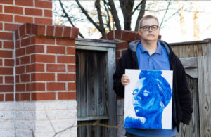 Raymond Walsh, who experienced homelessness, displays his artwork