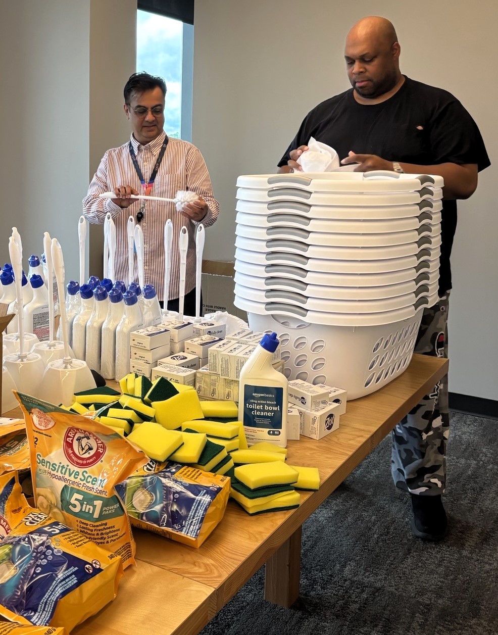 Amazon Web Services volunteers putting together baskets
